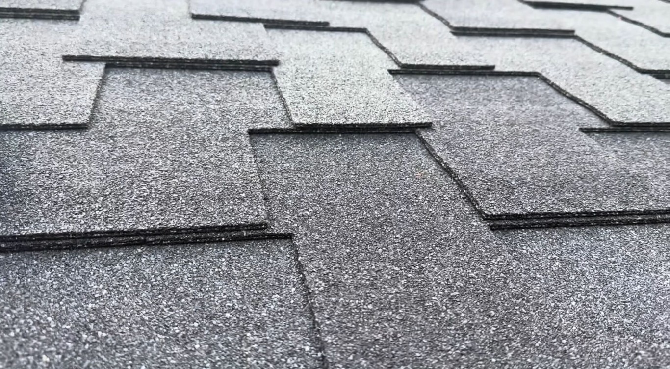 Close-up of damaged asphalt shingle roof needing repair in Delano, CA